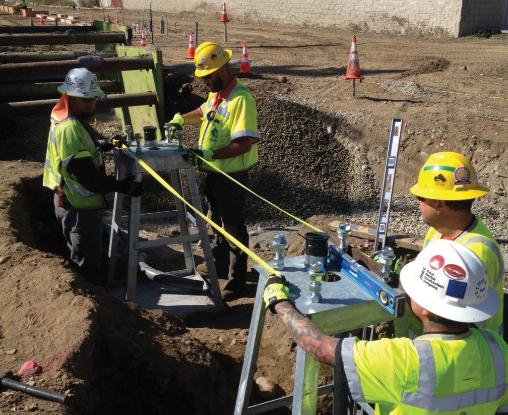 Crews set the foundations for the crossing gate at Highland Avenue in the City of Durate.