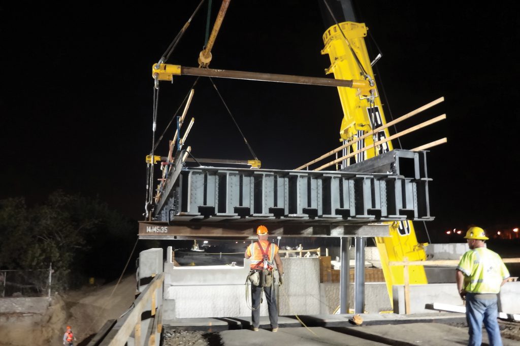 During a 54-hour cutover in the City of Azusa, crews relocate the superstructure of an existing steel freight bridge to its new alignment. 