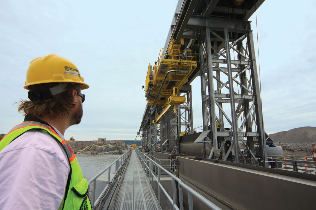 Lost in the moment – a Kiewit employee gazes on the successful commissioning of the stop log monorail crane.