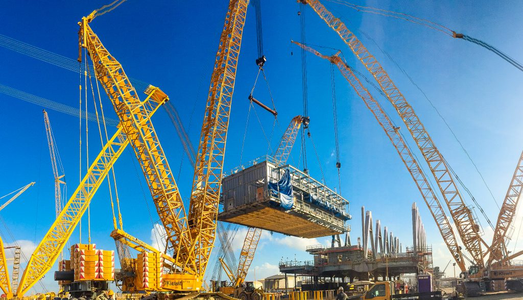 A multi-crane module lift takes place at the Kiewit Offshore Services yard in Ingleside, Texas.