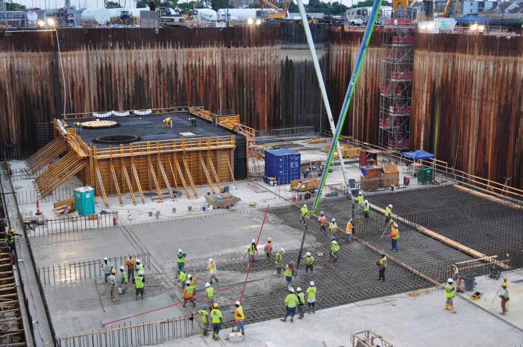 Crews pour the concrete pump station foundation at 17th Street. More than 70,000 cubic yards of structural concrete will be used before the completion of the project – enough to pour a 7-foot-thick slab of concrete over the entire flooring of the Superdome.