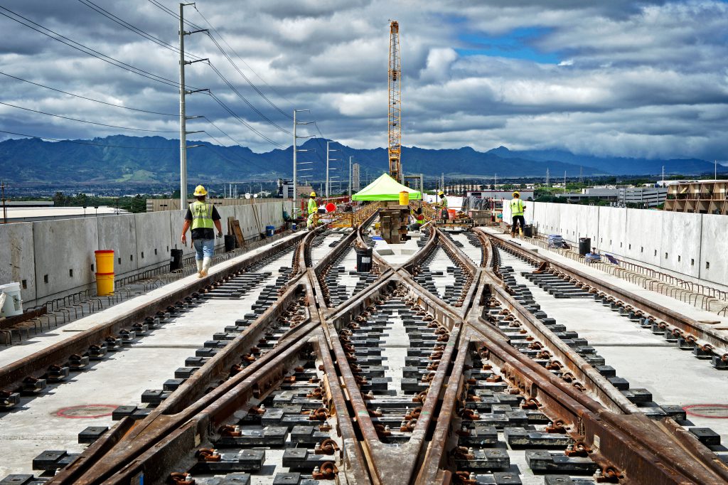 Kiewit laid 224,000 linear feet of rail and built various crossovers along the alignment, including at the future Pearlridge station.