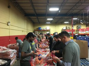 Employees sorted more than 32,000 pounds of food during Kiewit Feeds KC.