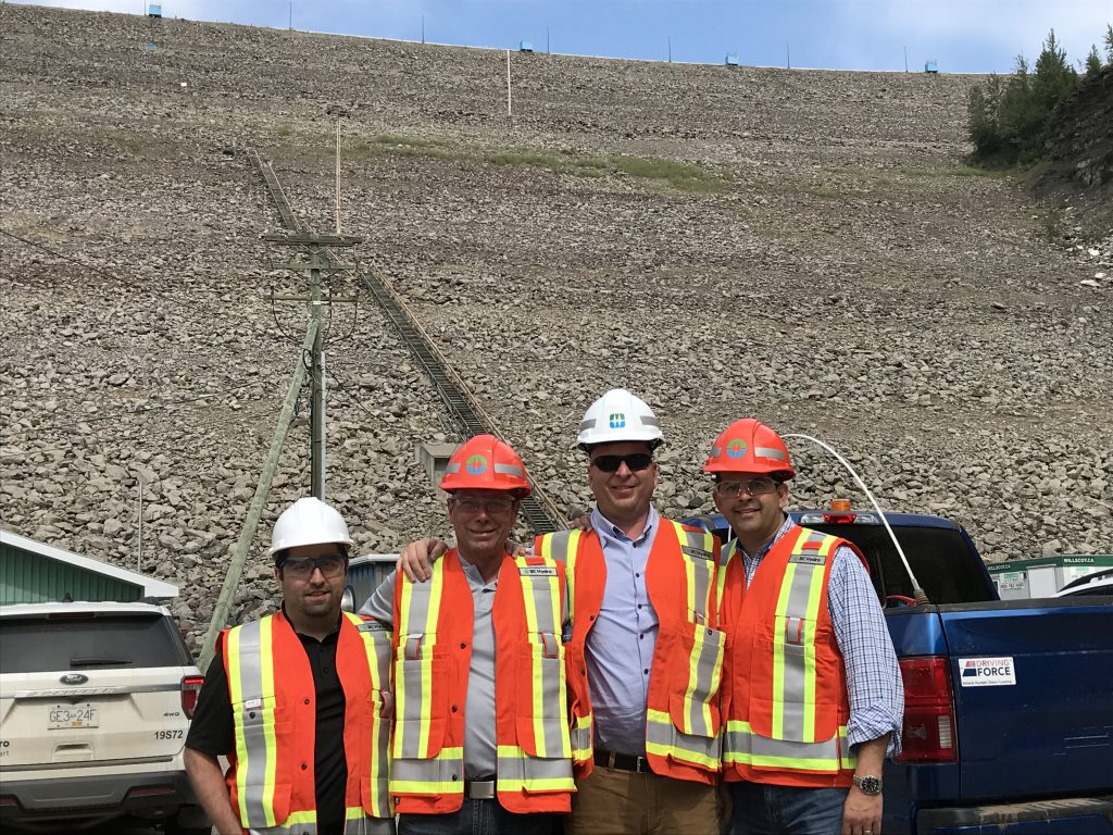 Kiewit employees Salim Semsarila, Tim Huffman, Jason Block and Ryan Tones are pictured at the dam.