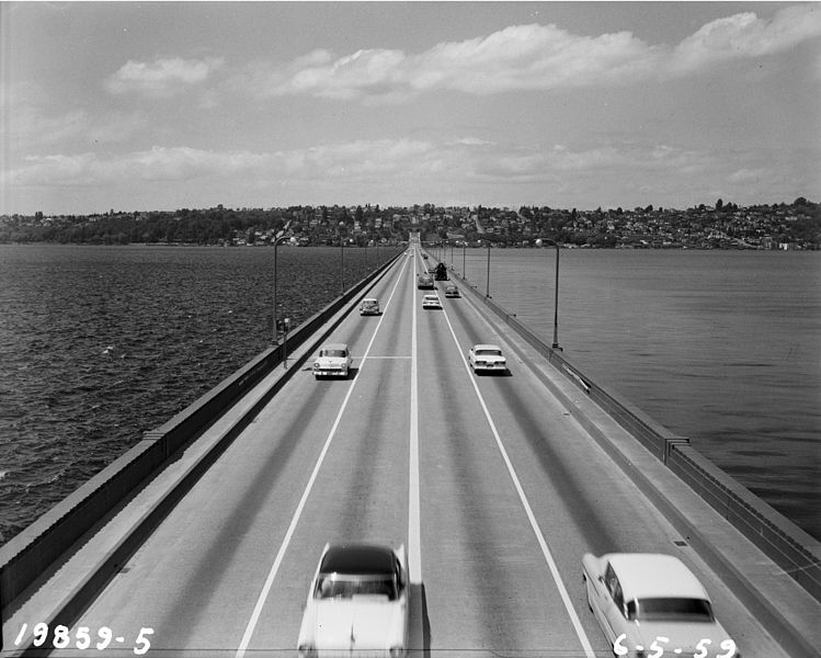 The view circa 1959 looking west from the original Lacey V. Murrow Memorial Bridge, which carried eastbound and westbound traffic across the lake. [Photo credit: Seattle Municipal Archives via Wikimedia Commons]