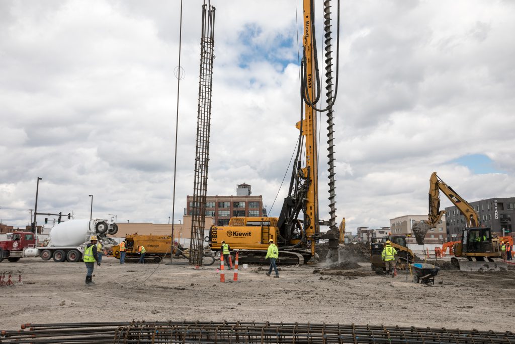 For structural support, 105 augered cast-in-place (ACIP) piles were drilled at the Kiewit headquarters in Omaha, Nebraska. Each was 24 inches in diameter and 56 feet deep.  