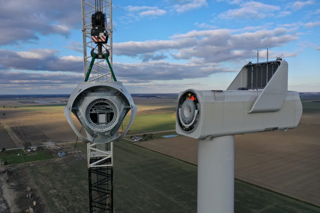 The hub of this Vestas V150-4.2 megawatt turbine is shown being set on the nacelle. The blades will be attached to the hub, which is 105 meters high. 