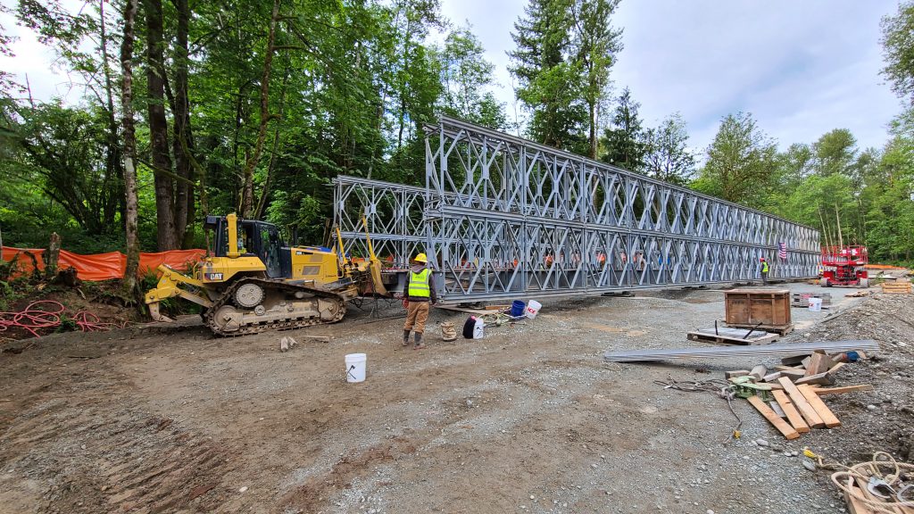 To keep traffic moving, crews built a 180-foot-long temporary bridge to span the creek.