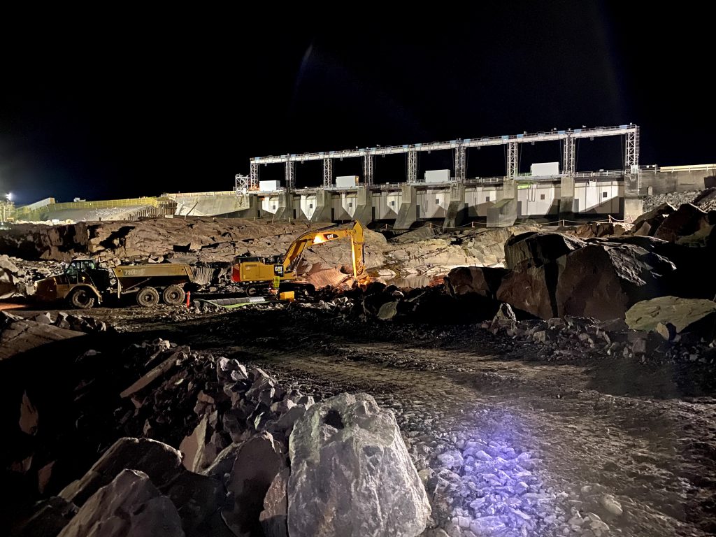 Rock excavation took place in the downstream channel with the excavated material being re-purposed as fill material for the project.
