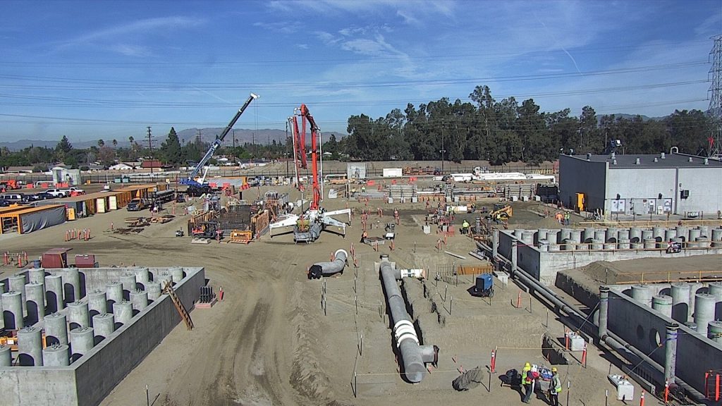 Crews install underground piping and electrical systems in addition to the granular activated carbon (GAC) vessel support columns (shown in the foreground) on the Tujunga site. The North Hollywood and Tujunga plants will extract water from two sets of existing, non-producing groundwater wells, treating 50 million gallons a day and 25 million gallons a day, respectively. 