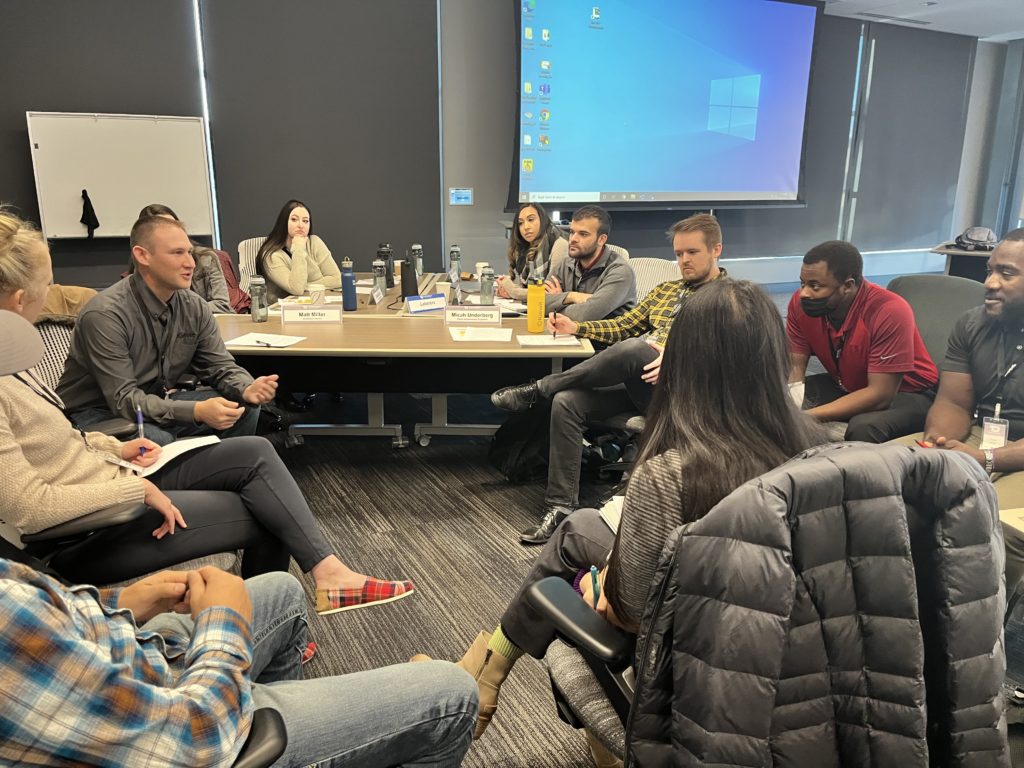 Kiewit employees interact at a live training session in Omaha, Nebraska. The session is part of Kiewit’s new NextGen hybrid training model designed to prepare future project leaders. 