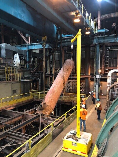 Crews remove an old feed water heater as part of the demolition work needed to prepare Unit 1 for new equipment.