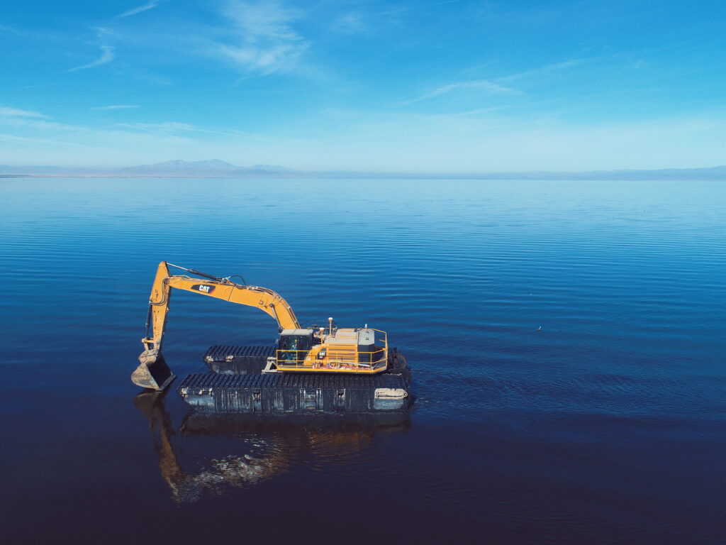 Here is a pontoon excavator, a key piece of equipment on the project. It’s amphibious and able to go to the most difficult areas of the project.