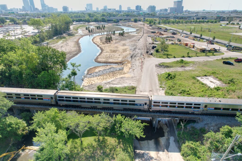 Kiewit crews replace an existing, artificial straight channel with a new, meandering channel with additional water containment areas, such as lagoons and tidal pools, to function more like a natural flood plain.