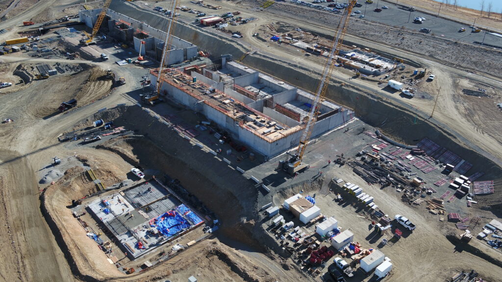 Building into the natural slopes of the hillside provided for a reduction in the heating and cooling energy required for the plant. It also allowed for all excavated materials to be used at the job site.