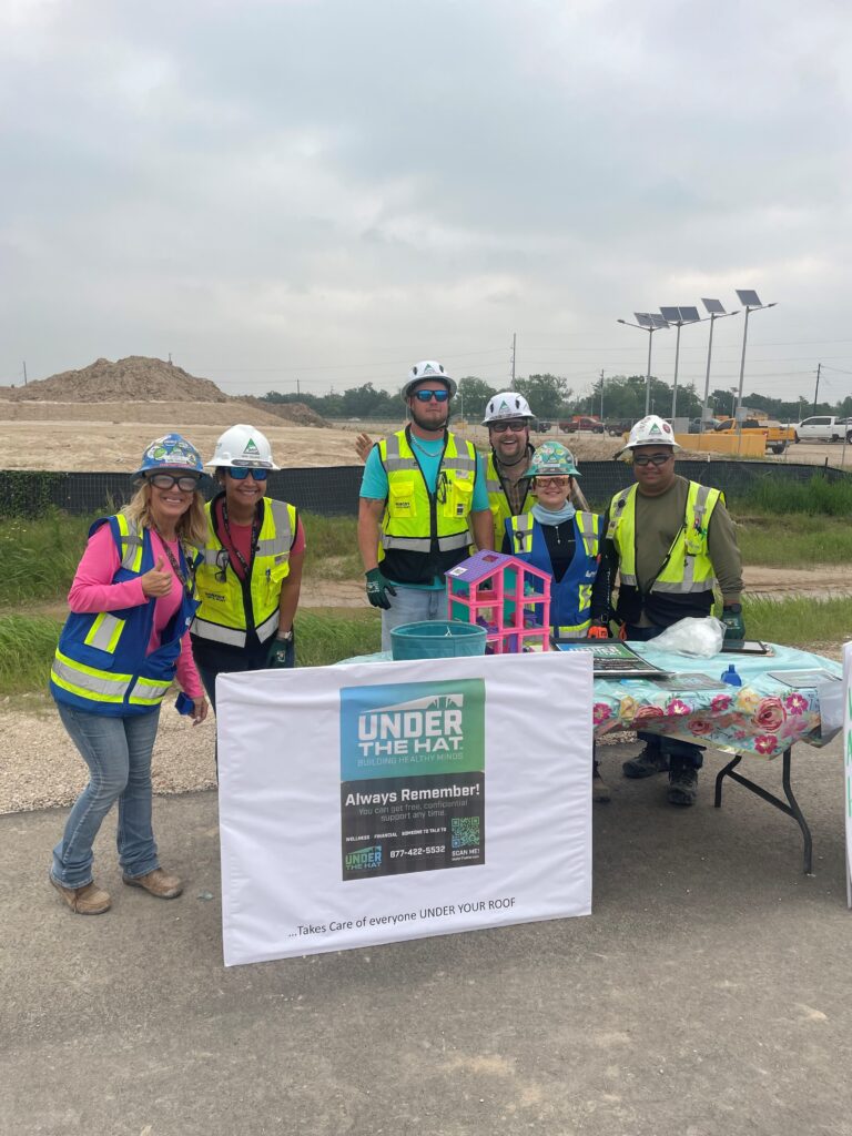 Former teacher Parker knows the power of visualization. To show that Kiewit’s mental health services are free for all household members, she displayed a dollhouse with a family, along with informative signage and flyers.