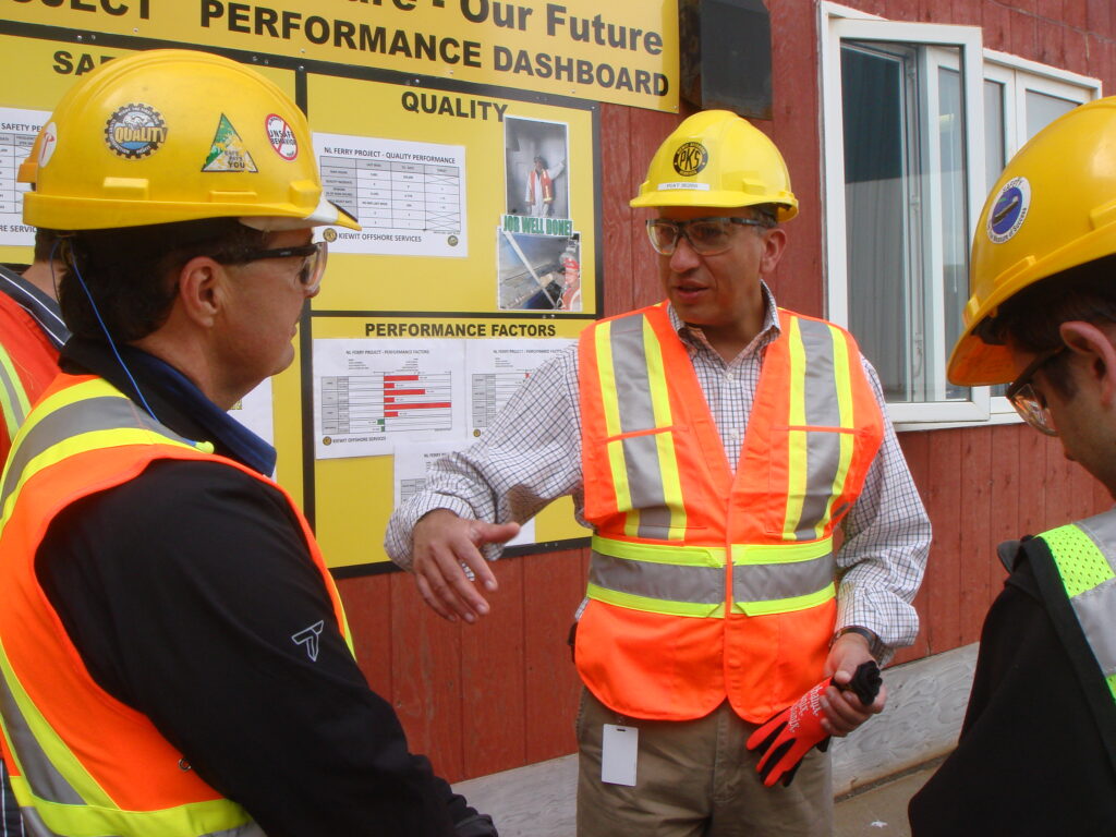 Ingleside crews gather around Sezer as he walks through safety and quality metrics posted on a continuous improvement dashboard with the slogan “Our Yard. Our Welfare. Our Future.” 
