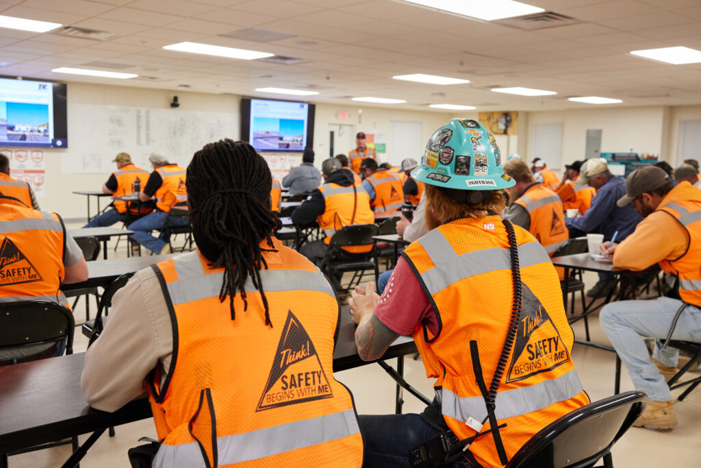 Operational supervisors meet for the “Play of the Day” meeting, a project-wide check-in to align on daily goals. For developing leaders, it’s an opportunity to see how their work connects to the larger operation.
